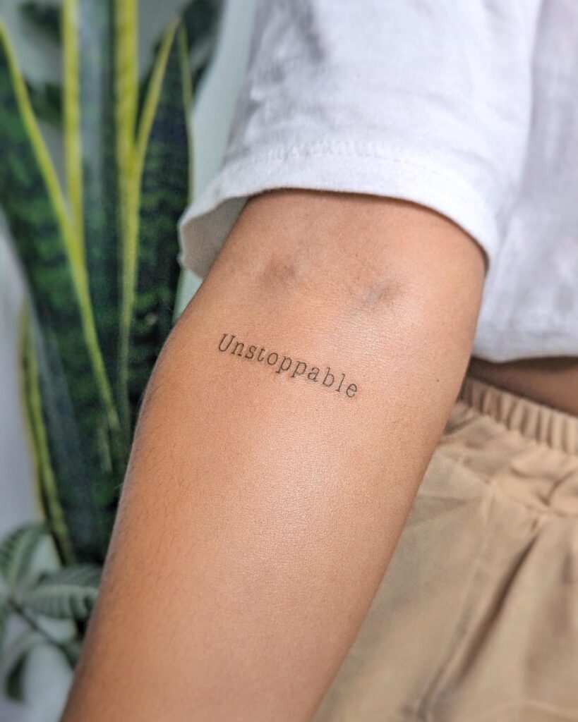'Unstoppable' Text Lettering Tattoo on the Below the Elbow: Indomitable Spirit